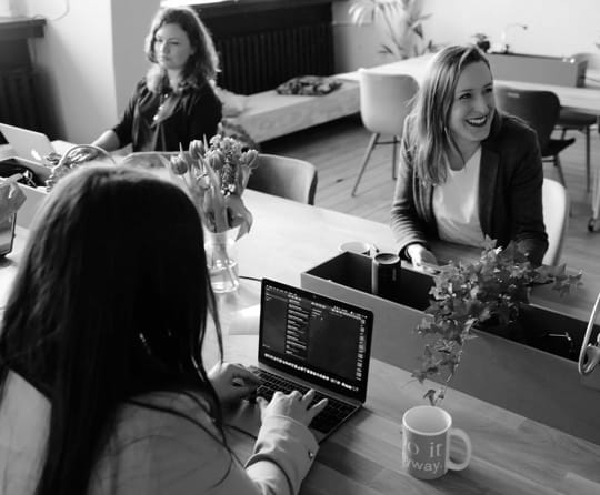 women working and smiling